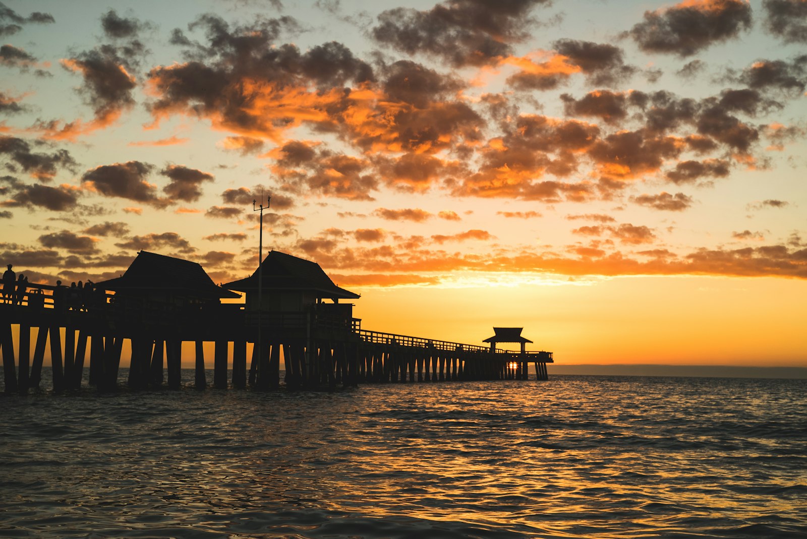 The Naples Pier at sunset in Naples, Florida