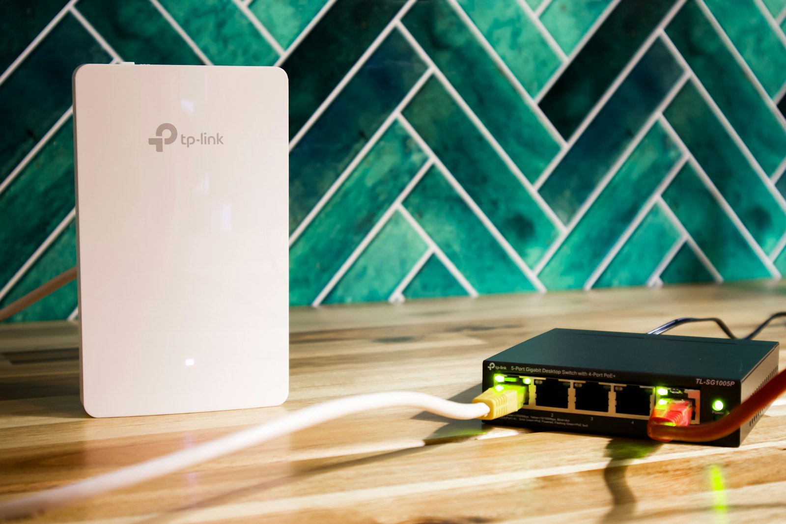 Office Wi-Fi access point and network switch on a desk