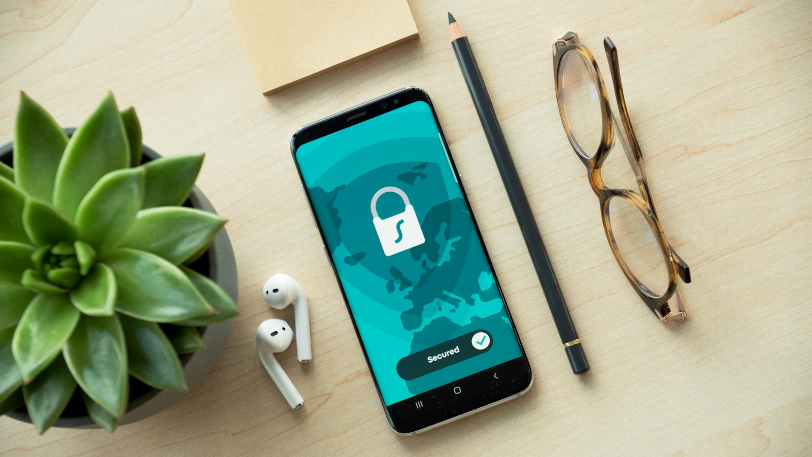 Smartphone showing a security lock screen on a wooden desk