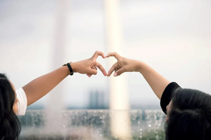 Two hands forming a heart shape