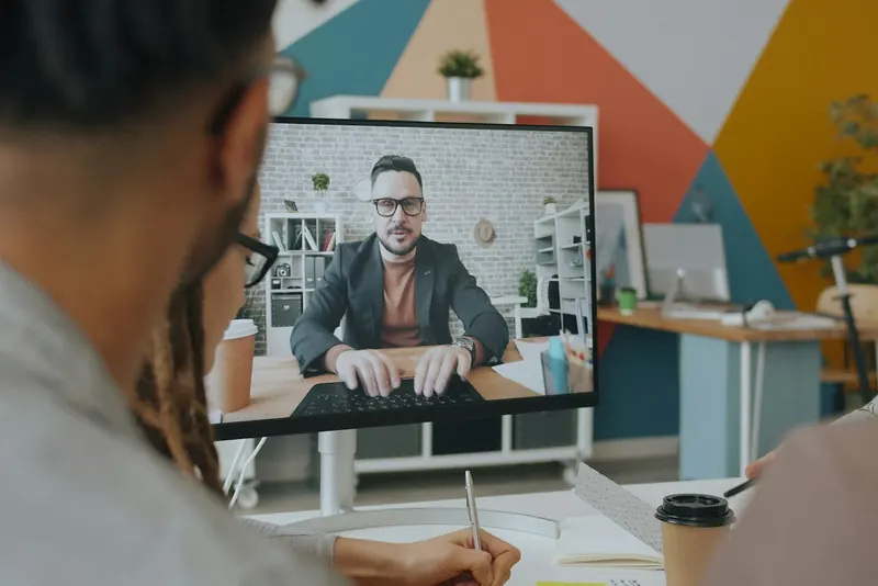 Team video call on an office monitor