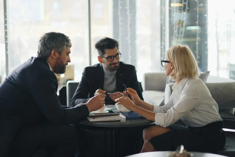 Business team discussing a plan around a table